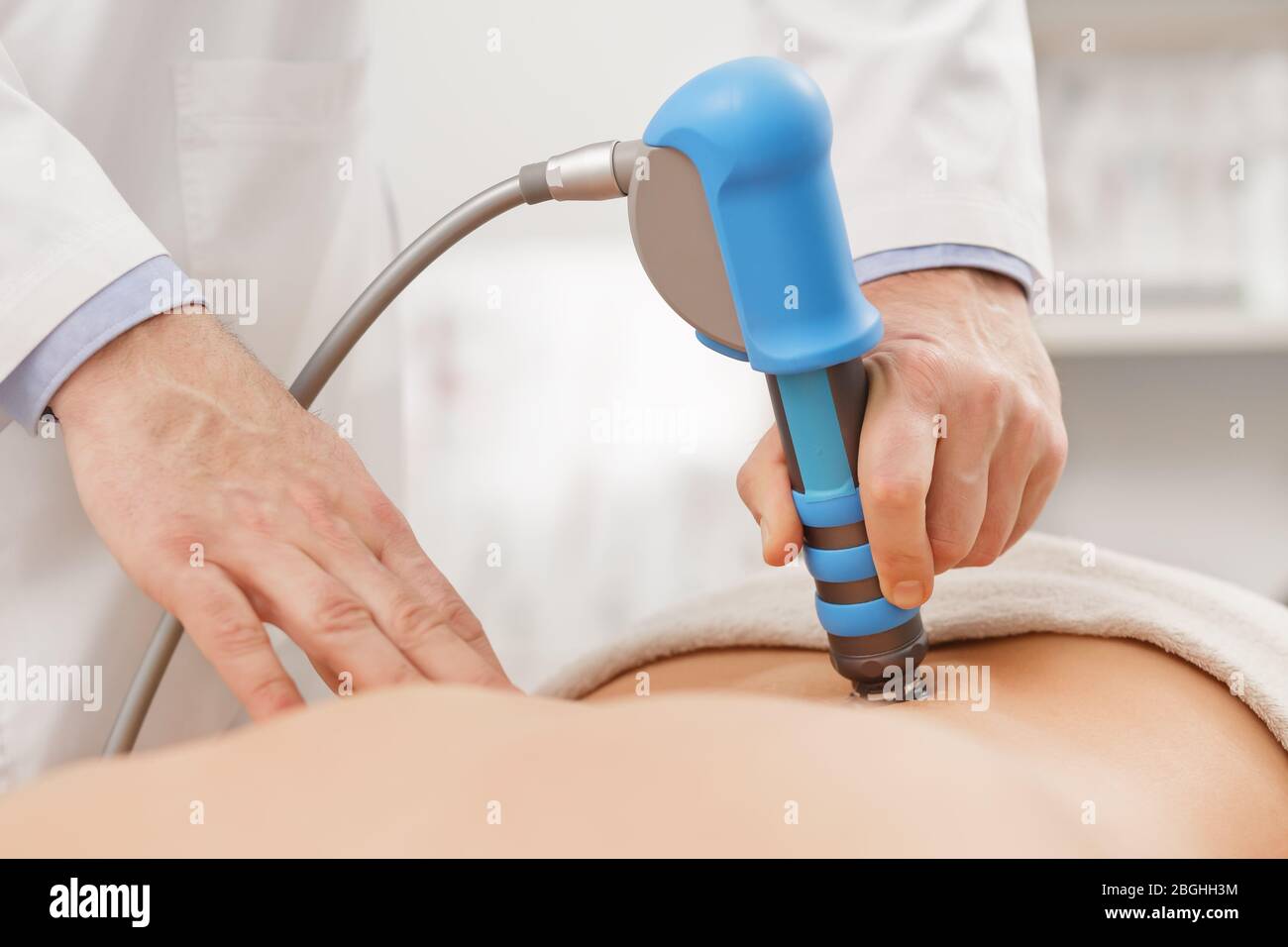 https://c8.alamy.com/comp/2BGHH3M/extracorporeal-shockwave-therapy-eswteffective-non-surgical-treatmentphysical-therapy-for-lower-back-with-shock-wavespain-relief-normalization-and-2BGHH3M.jpg