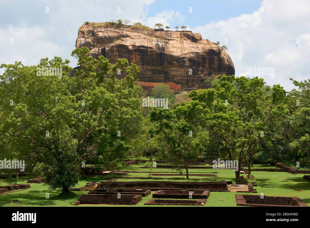 Sigiriya Rock in Sri Lanka, seen from archeological site. This popular tourist attraction is a UNESCO World Heritage Site and features ruins from the Stock Photo