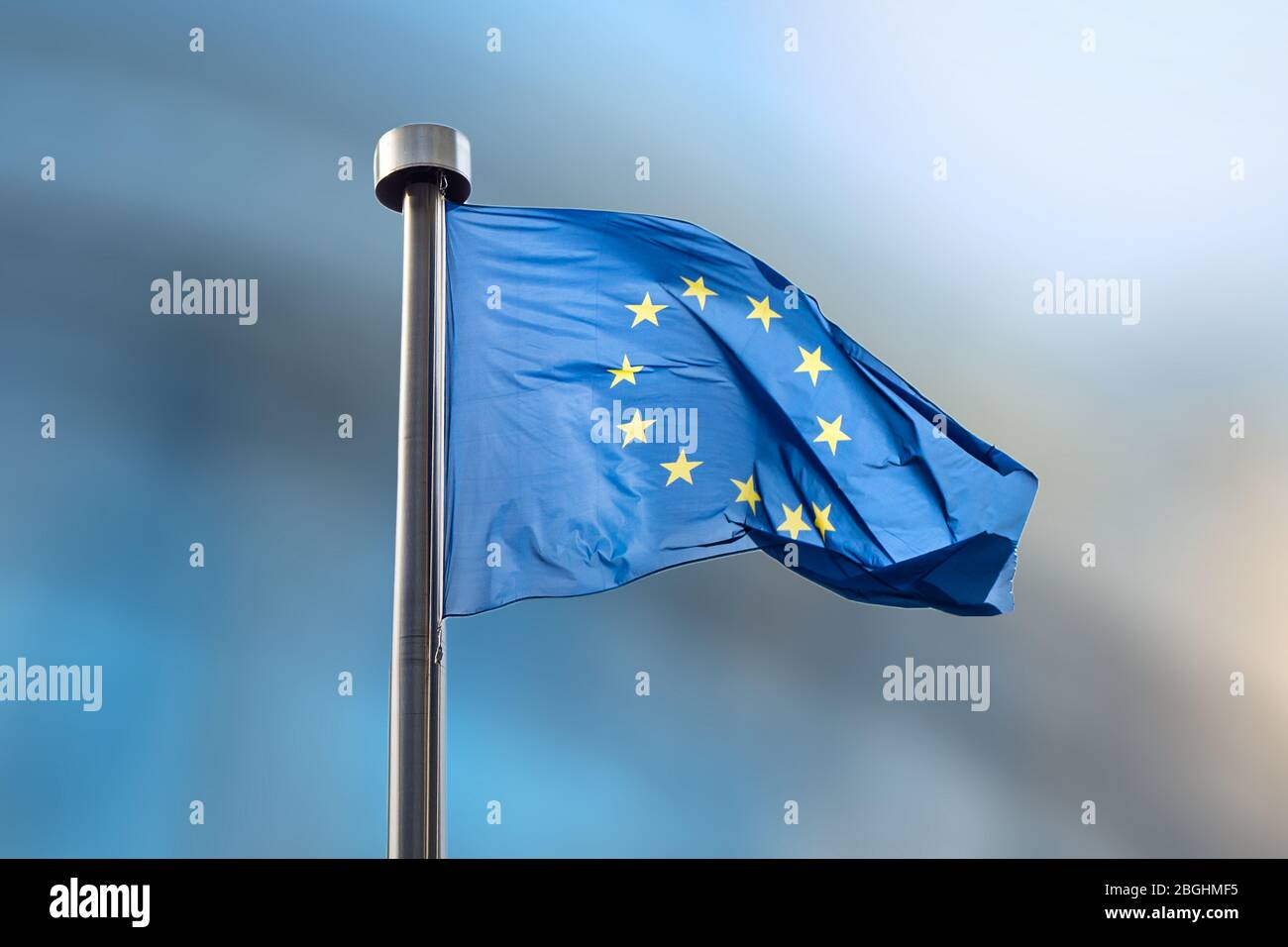 European Union flag on a blurred background Stock Photo - Alamy