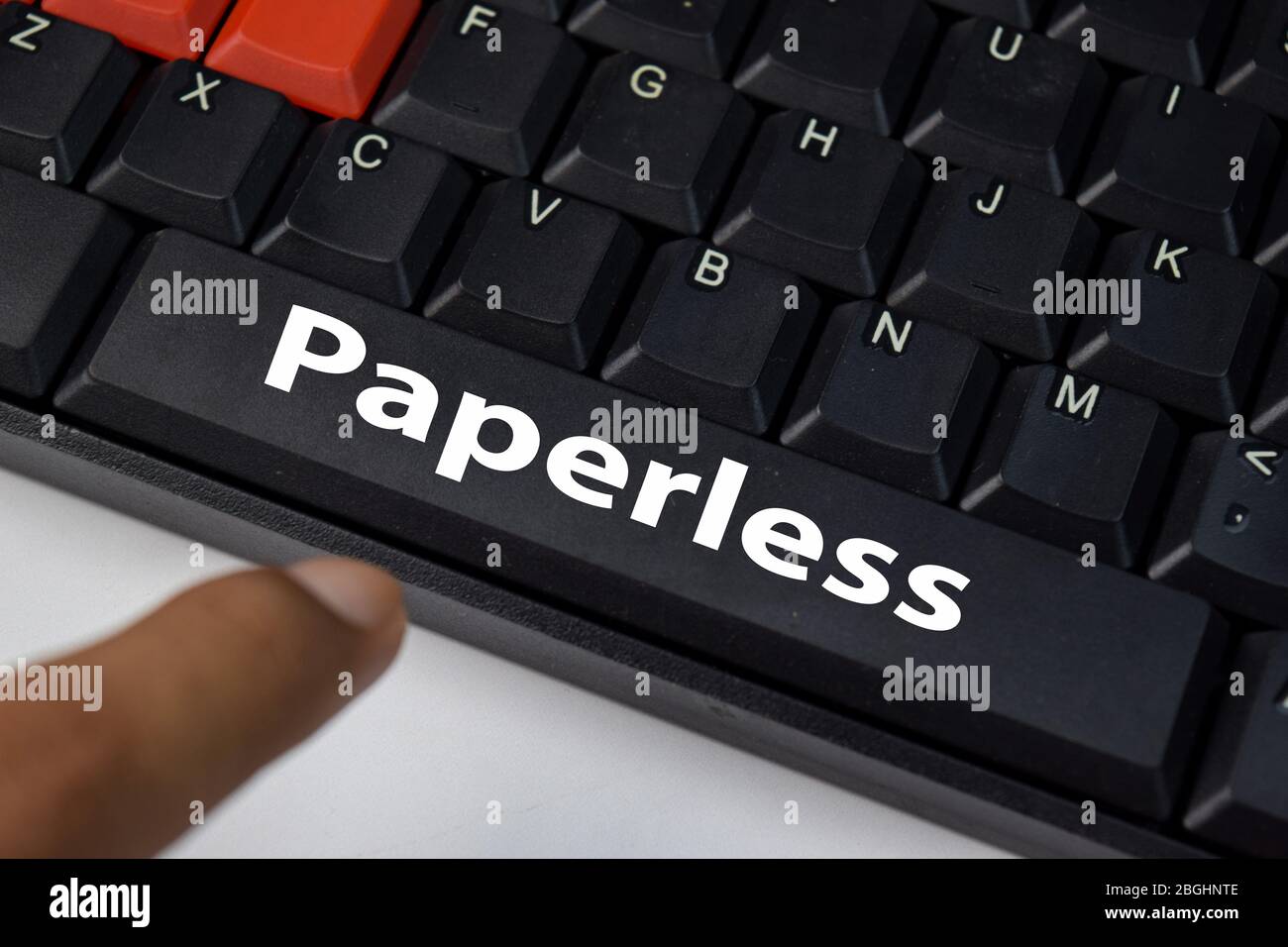 Paperless isolated on laptop keyboard background. Stock Photo