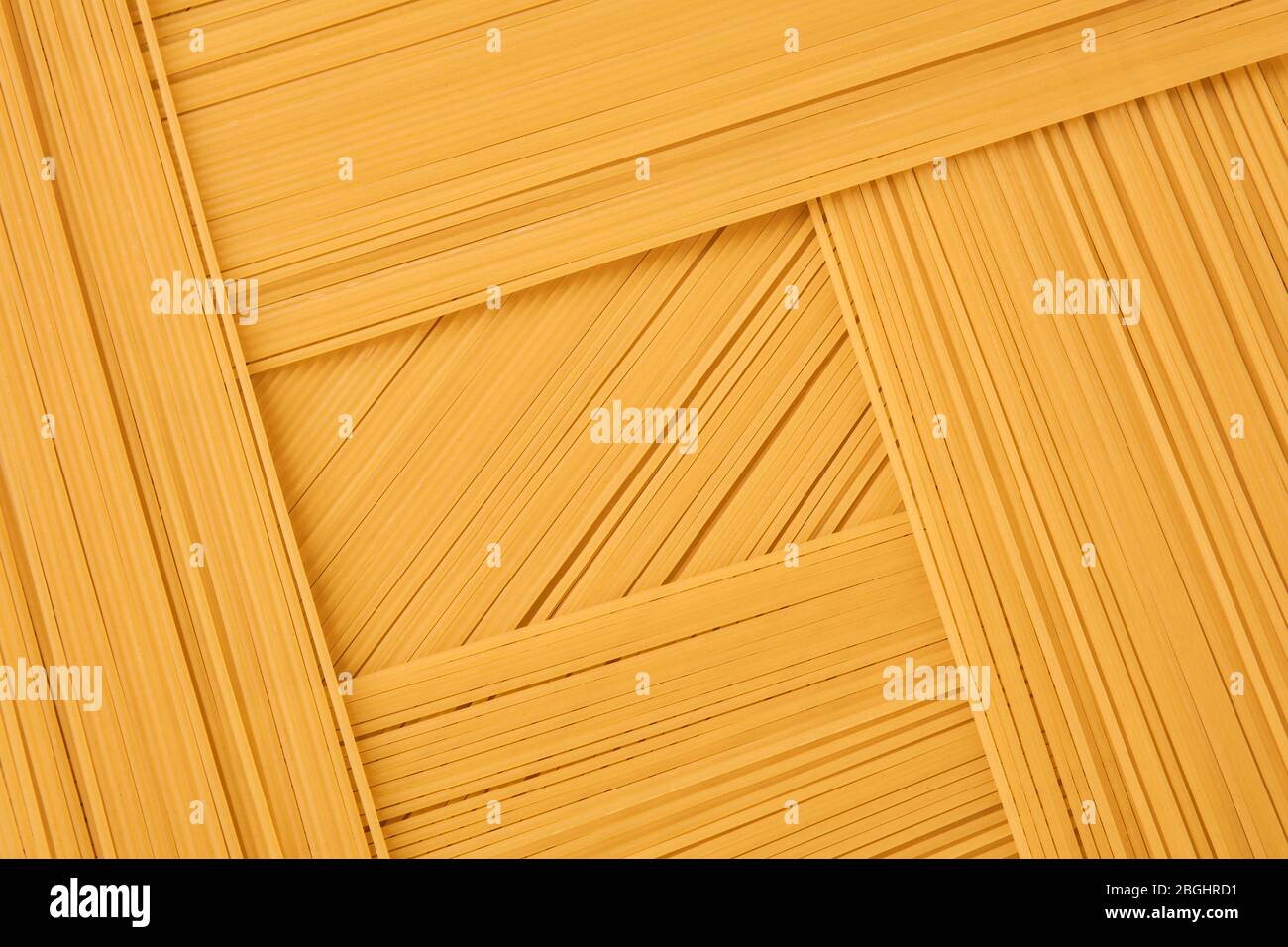 background of long and shortcut dry pasta, spaghetti laid out in several layers Stock Photo Alamy