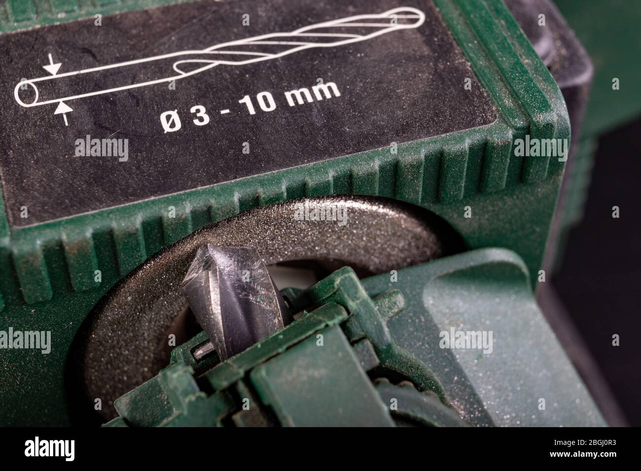 Sharpening a metal drill bit. Steel drill sharpened for specialized