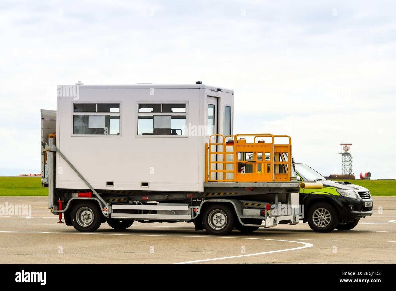 CARDIFF, WALES - JUNE 2019: Specialist hydraulic lift vehicle at Cardiff Wales Airport. It is used to lift passengers in wheelchairs up to an aircraft Stock Photo