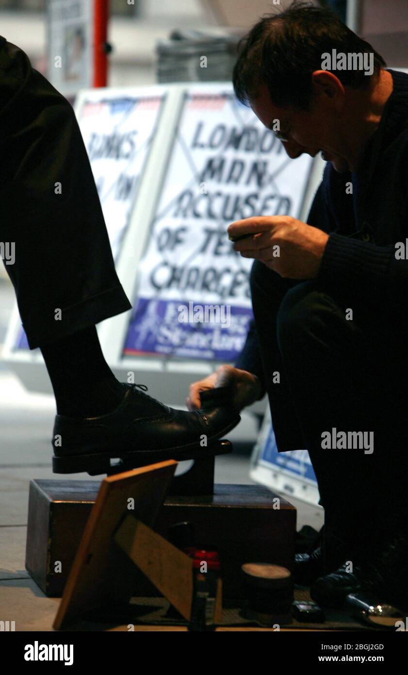A shoe polisher in London Stock Photo Alamy