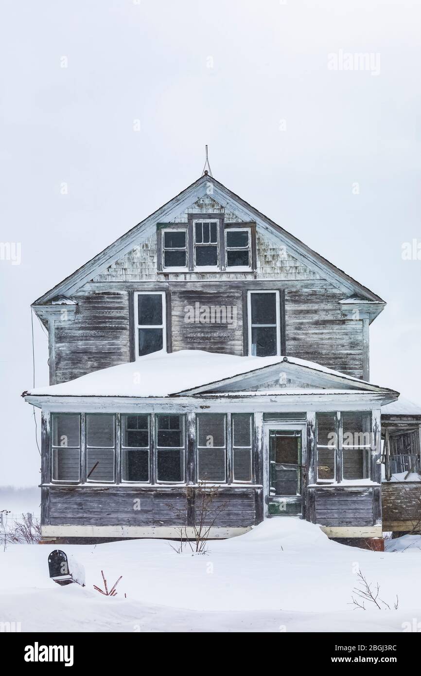 Old and forlorn farmhouse, probably abandoned, in the eastern Upper Peninsula, Michigan, USA [No