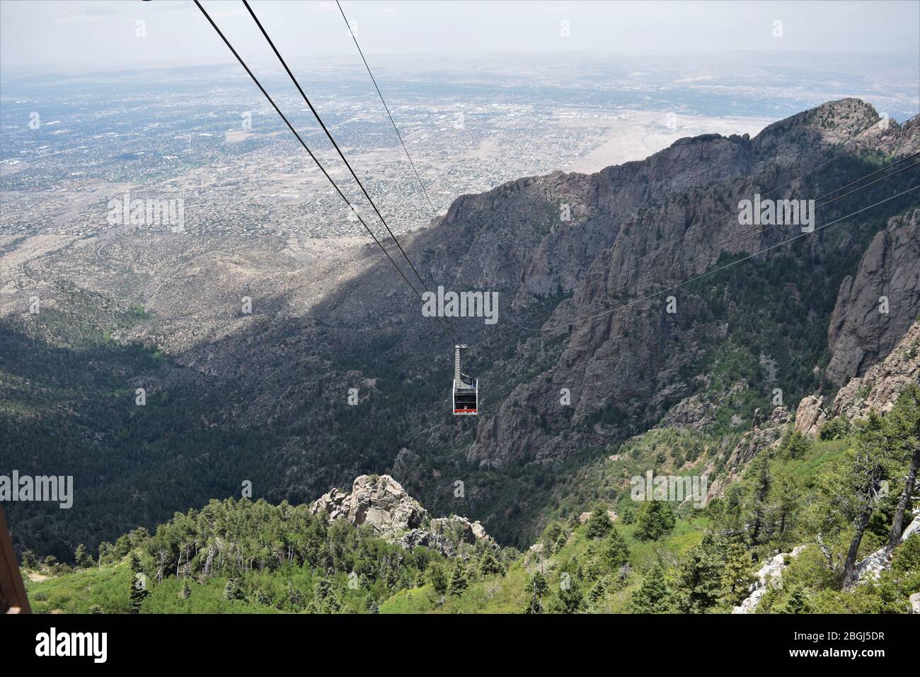 The Sandia Peak tram in Albuquerque New Mexico rises approximately 5,000 feet to the top of the mountain and offers stunning views Stock Photo