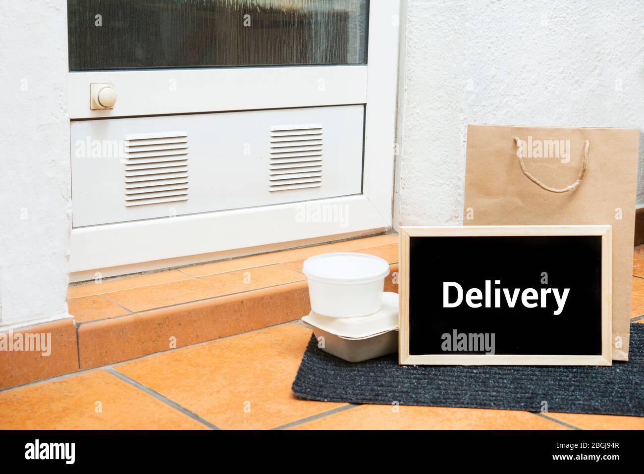 home delivery service, boxes standing by the house doors Stock Photo ...
