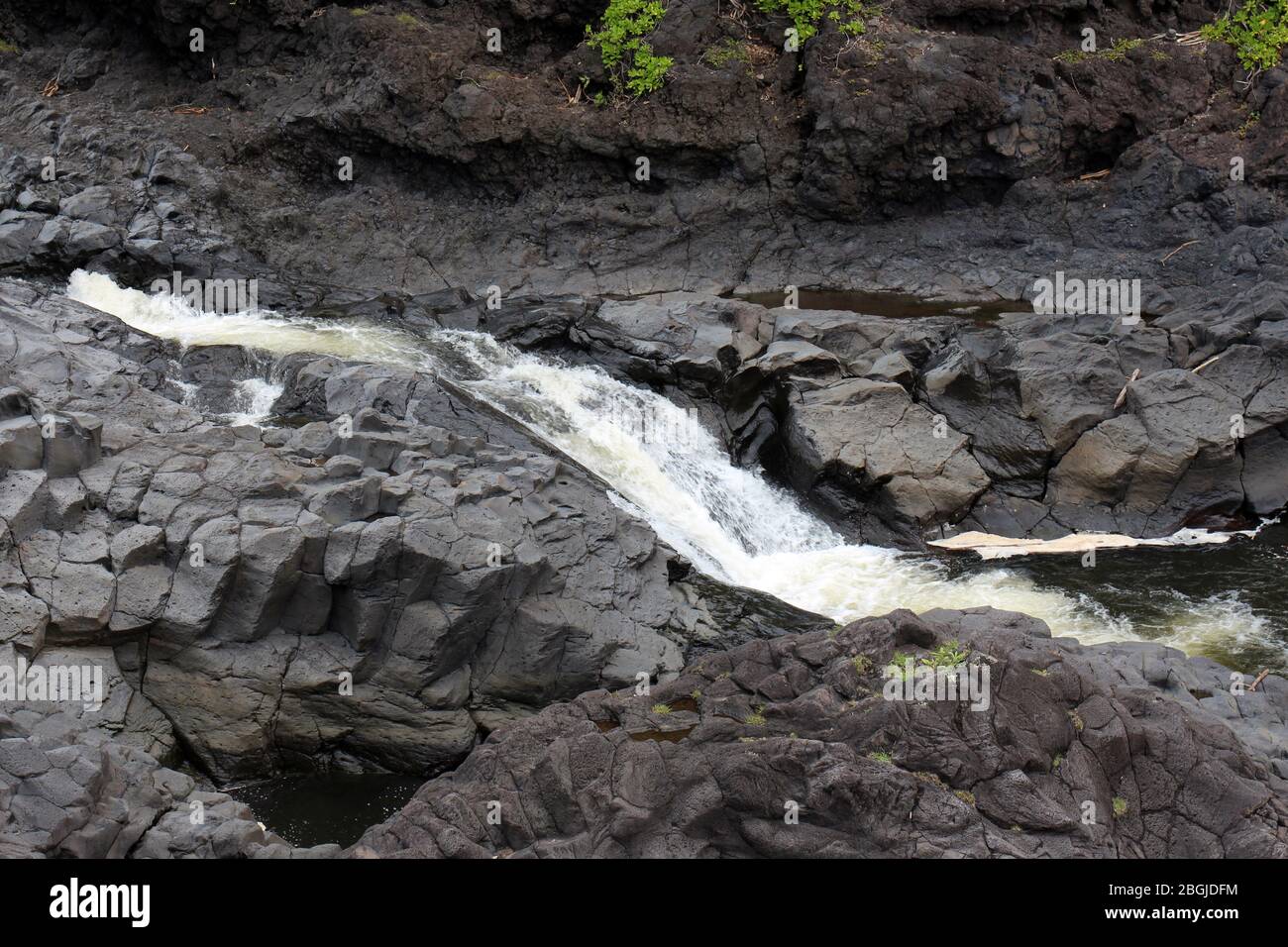 A section of Palikea Stream, Oheo Gulch, Seven Sacred Pools, running through volcanic rock in the Kipahulu District, Maui, Hawaii, USA Stock Photo