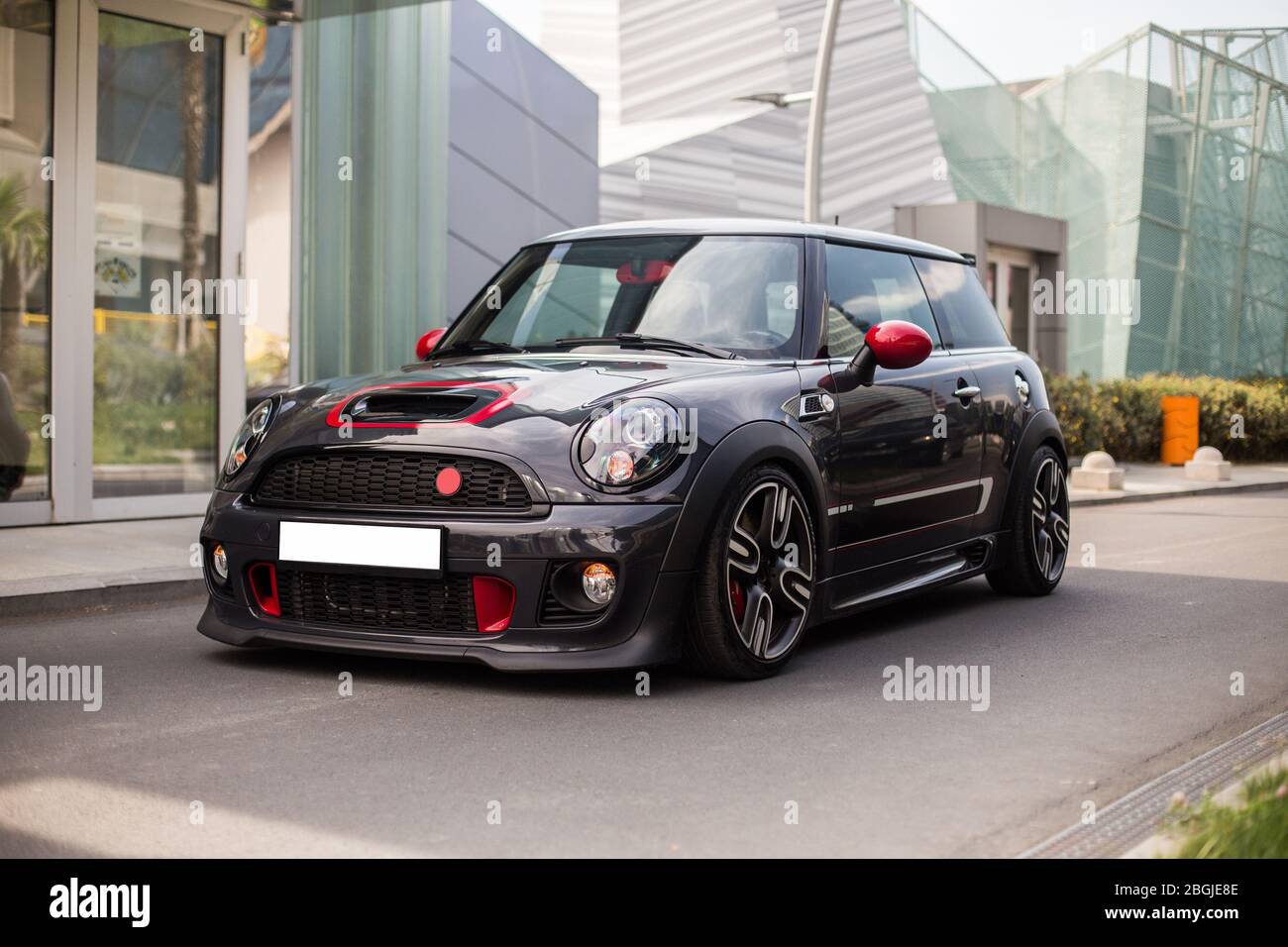 Black mini car with red decorations on it Stock Photo - Alamy