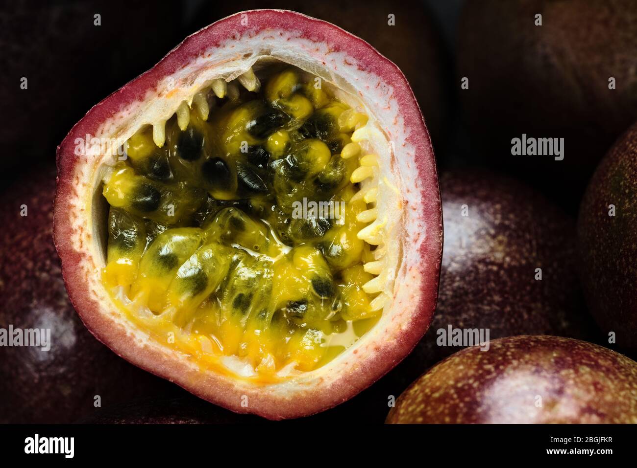 Halved granadilla on badea barbadine grenadine maracuja passion fruits Stock Photo