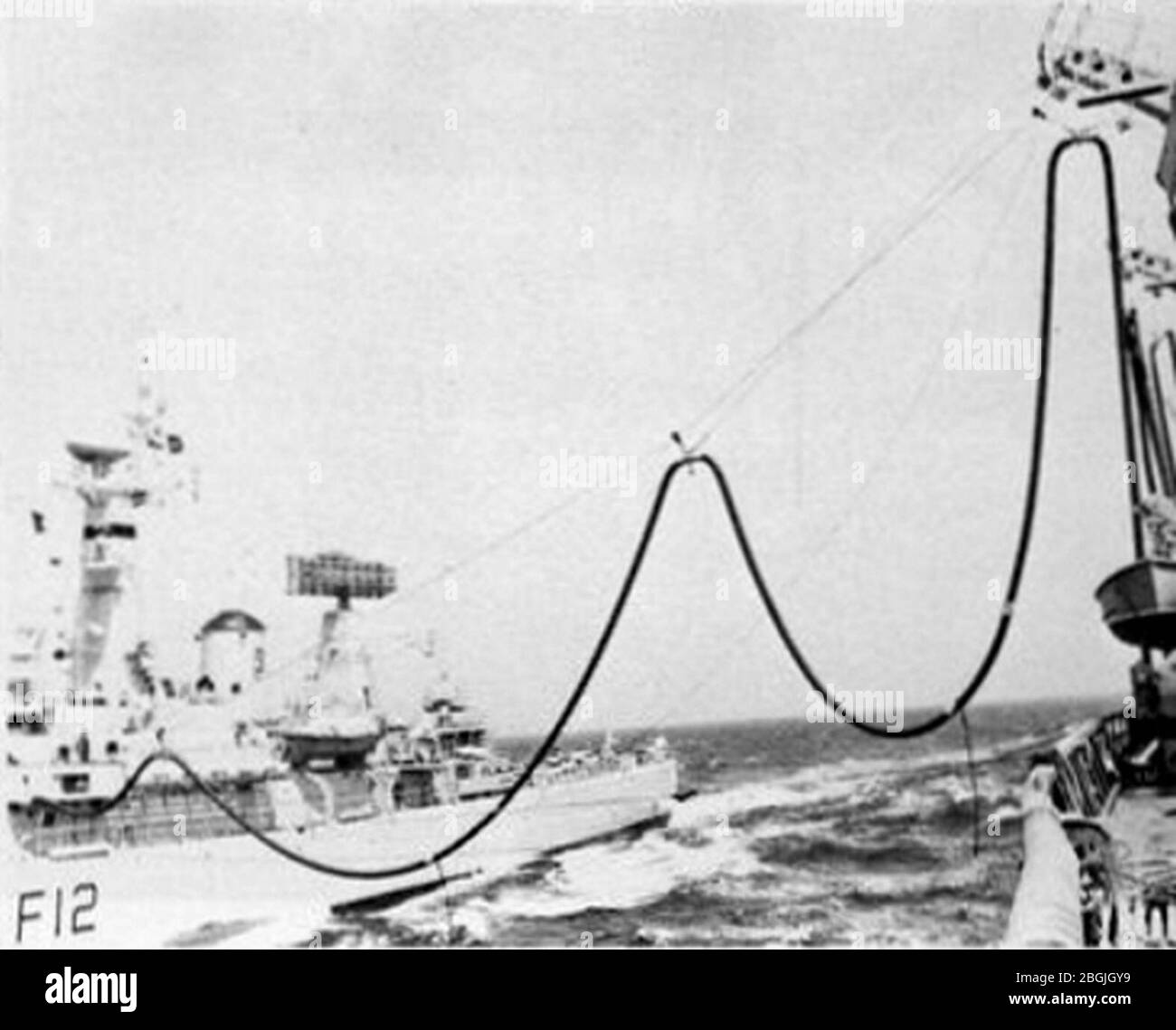 HMS Achilles (F12) refueling from USS Savannah (AOR-4) circa in 1974. Stock Photo