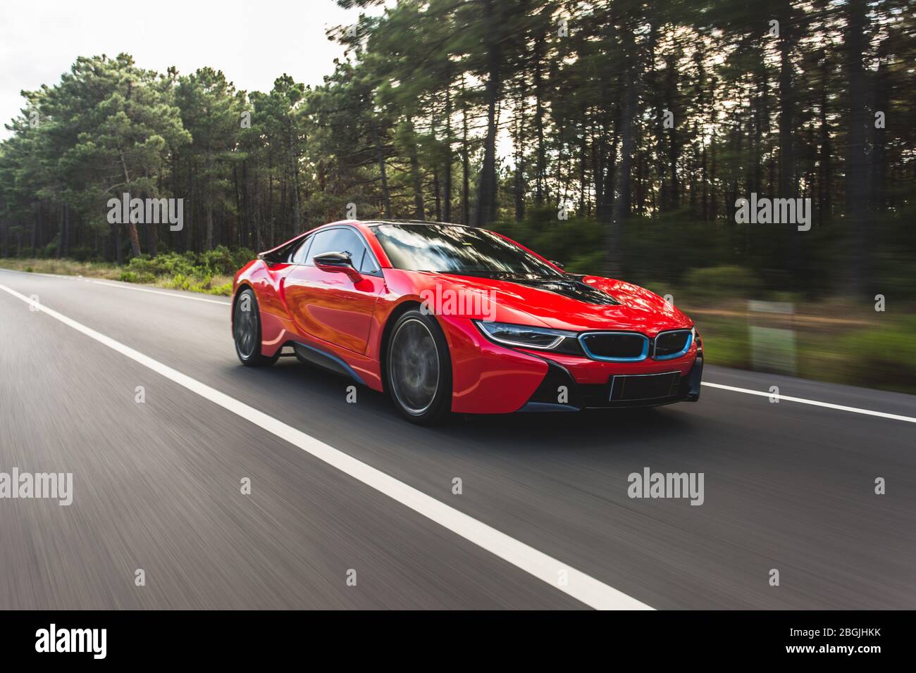 Red race car with black stripe on it Stock Photo Alamy