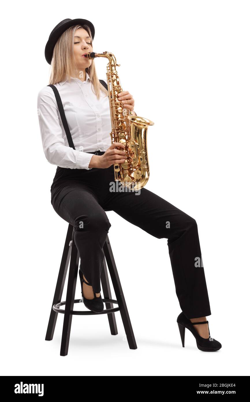 Young blond female artist playing a saxophone isolated on white