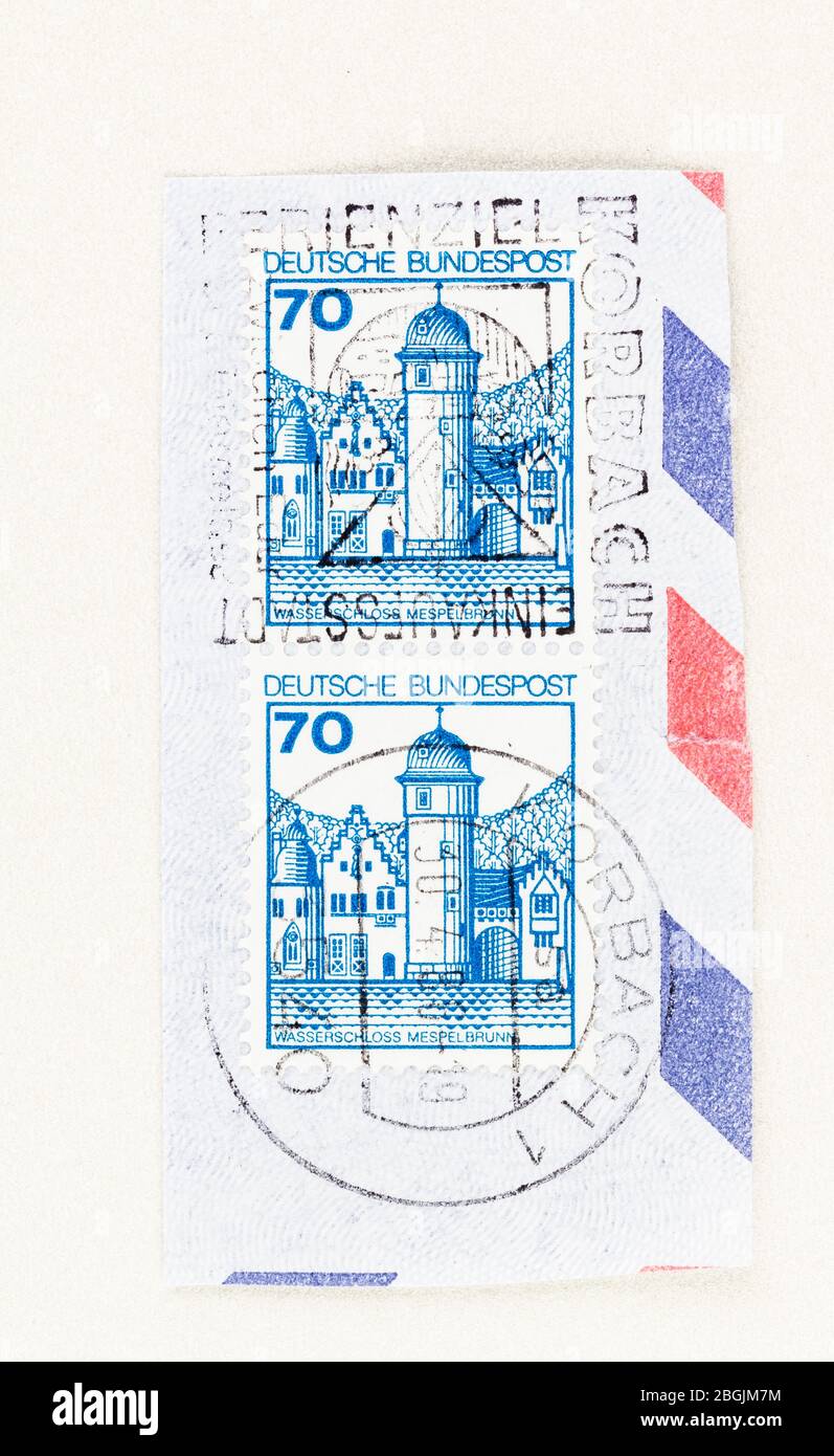 SEATTLE WASHINGTON - April 20, 2020: Close up of  two joined German stamps, featuring Mespelbrunn Castle with moat, issued 1977. Scott # 1238. Stock Photo