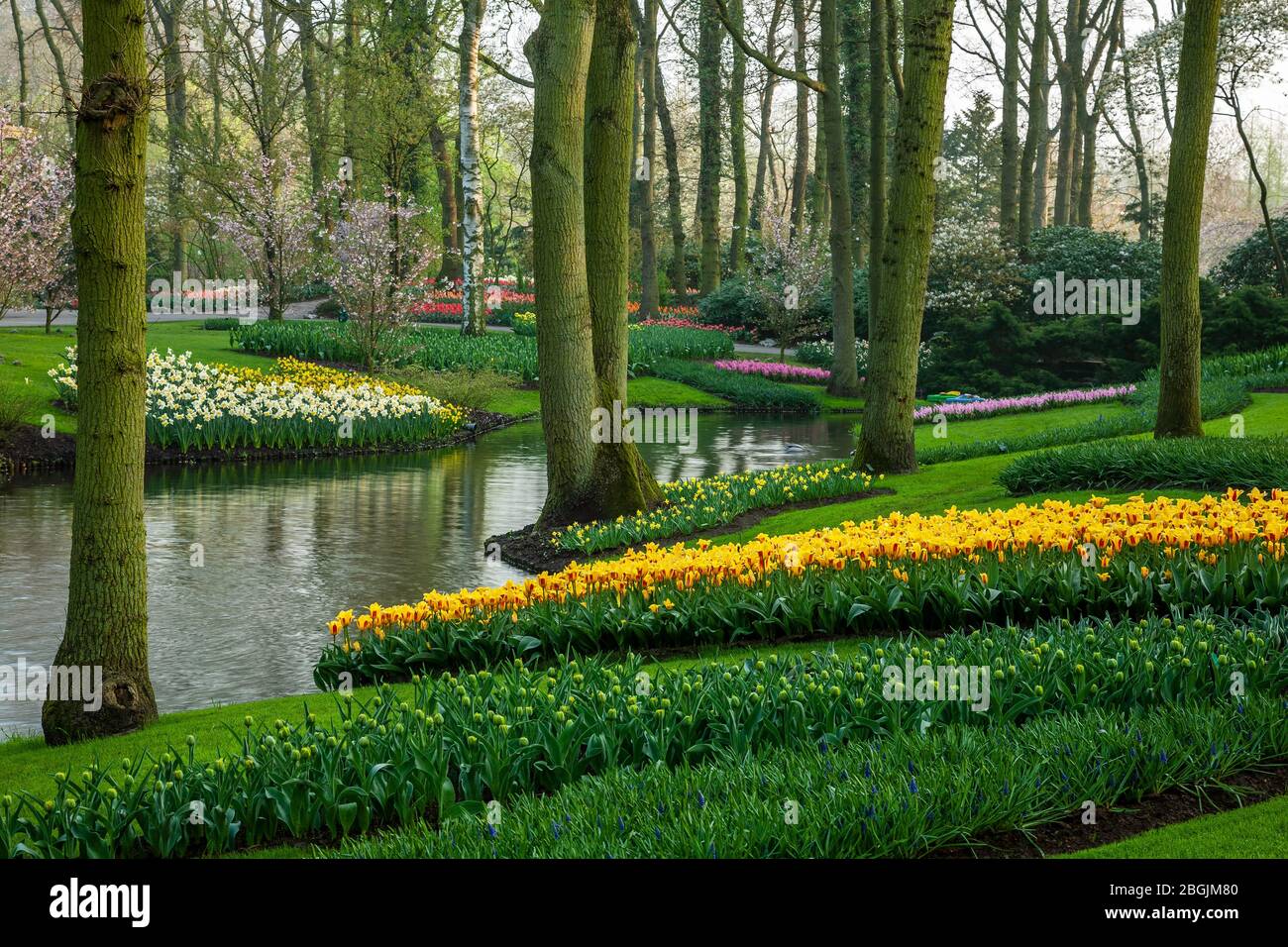 Gardens and pond, Keukenhof Gardens, near Lisse, Netherlands Stock Photo