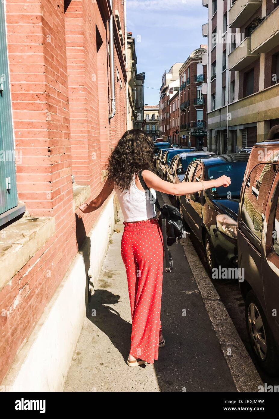 Woman dancing in the street Stock Photo