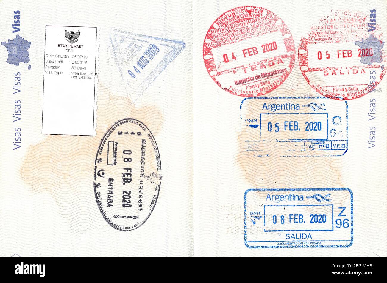 Stamps of Indonesia, Uruguay, Paraguay and Argentina in French passport Stock Photo