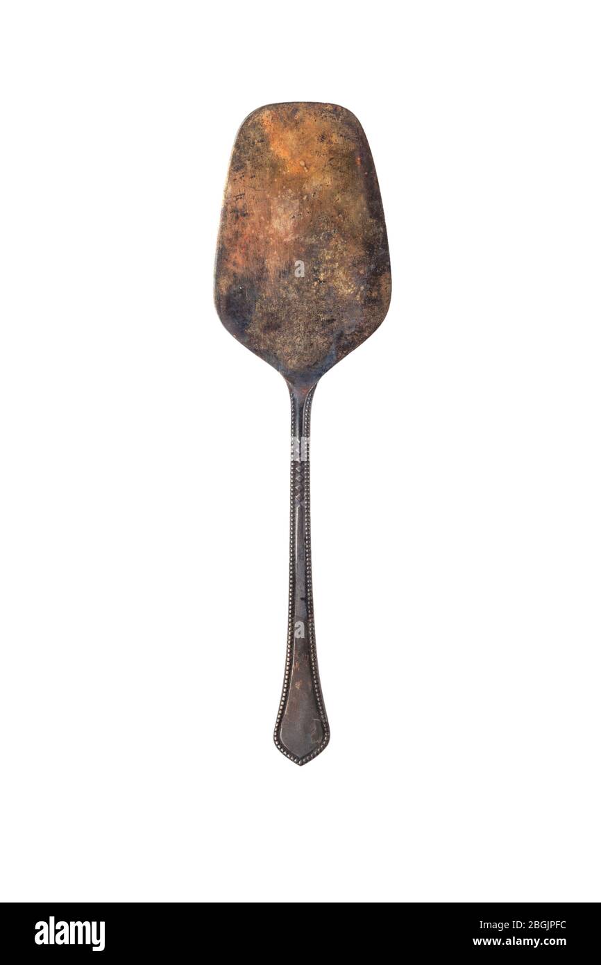 Antique vintage tabletop shovel made of cupronickel. isolated on white background Stock Photo