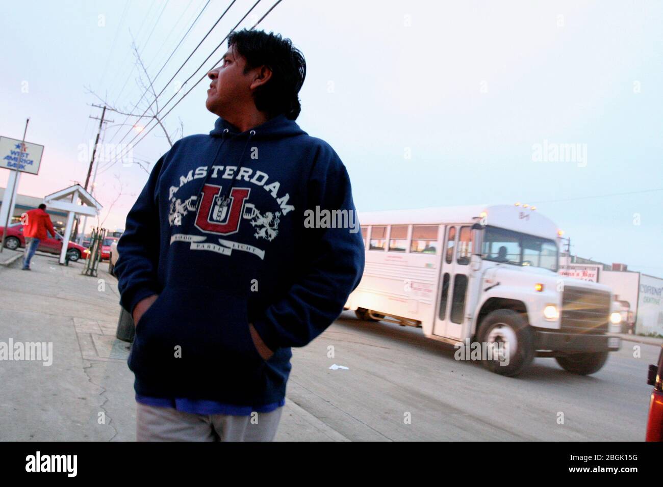 Huron, California, USA. 12th Apr, 2006. ENRIQUE, a mexican illegal immigrant farmworker, walks the streets of Huron at dawn in search of a days work picking lettuce. California's Central Valley offers at least seasonal jobs to 600,000 to 700,000 workers each year. Credit: Robert Gallagher/ZUMA Wire/Alamy Live News Stock Photo