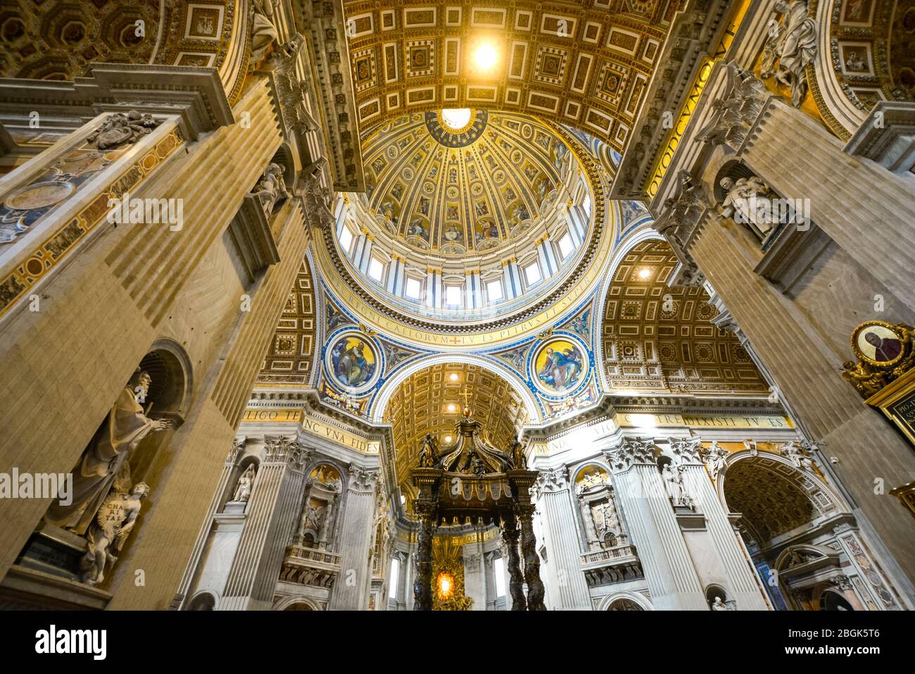 The ornate, renaissance interior, dome, cupola and ceiling of St Peter's Basilica in Vatican