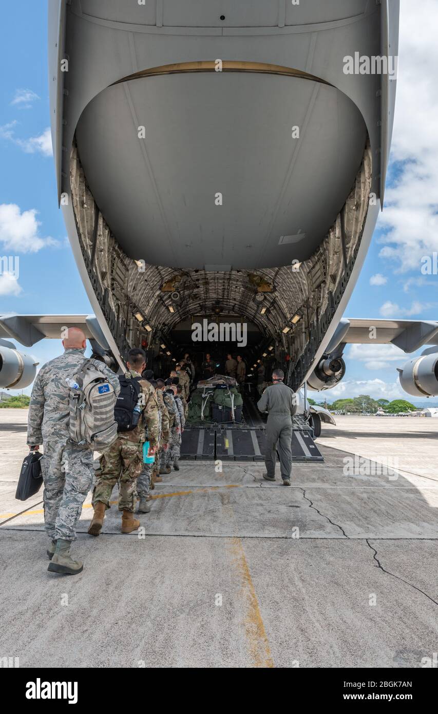 Members of the Hawaii National Guard boarding a C17, from the 204th Airlift Squadron, Hawaii