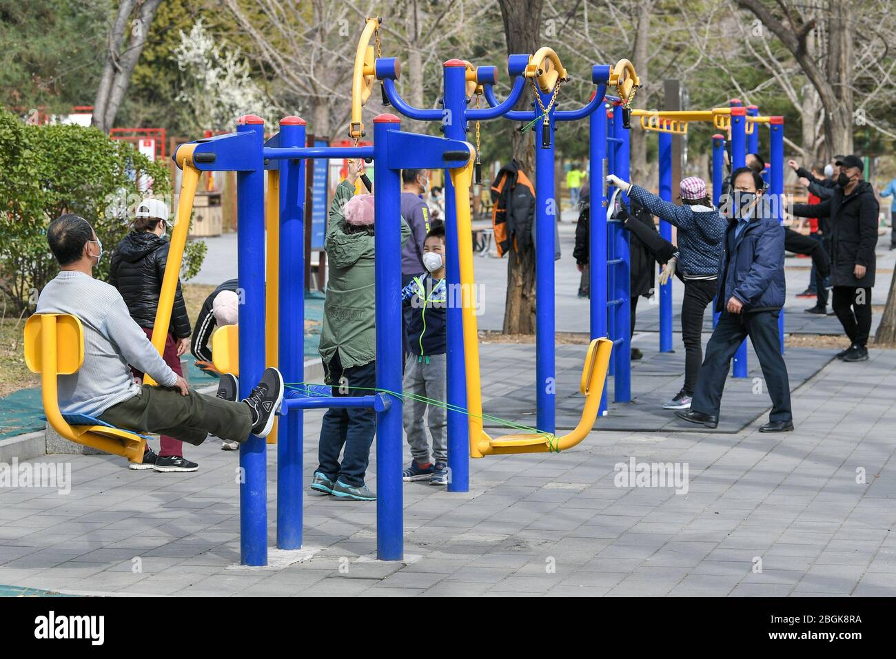 https://c8.alamy.com/comp/2BGK8RA/citizens-do-exercise-by-jogging-or-with-fitness-equipment-at-a-local-park-as-weather-warms-up-beijing-china-12-march-2020-local-caption-fa-2BGK8RA.jpg