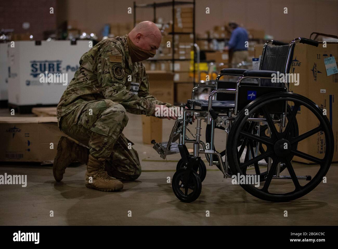 U.S. Air Force Master Sgt. Richard Thomas, with the New Jersey Air National Guard’s 108th Wing, assembles a wheelchair at a Federal Medical Station set up at the Atlantic City Convention Center in Atlantic City, N.J., April 15, 2020. (U.S. Air National Guard photo by Master Sgt. Matt Hecht) Stock Photo