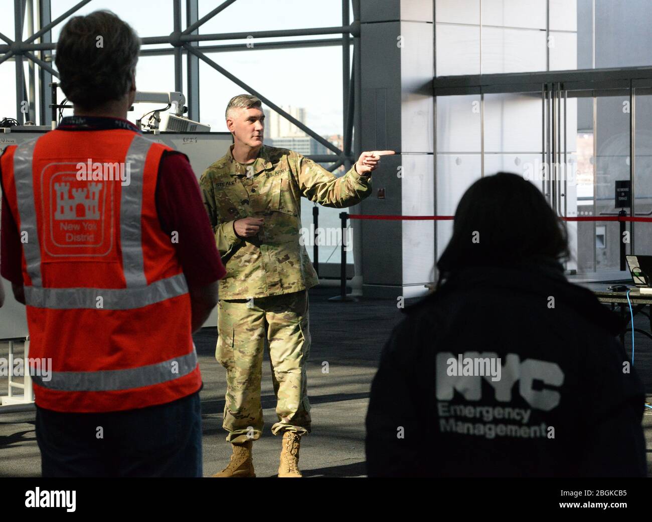 Lt. Col. Robert Stealey, of the New York Army National Guard, gives a briefing at the Jacob K. Javits Convention Center in New York, N.Y., March 24, 2020. The convention center will be an alternate care site as part of New York’s multi-agency response to COVID-19. (U.S. Air National Guard photo by Senior Airman Sean Madden) Stock Photo