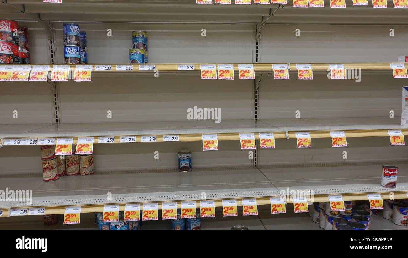 Empty shelves for soup in a grocery store. People are hoarding food to prepare for the worst in Coronavirus scare. Stock Photo