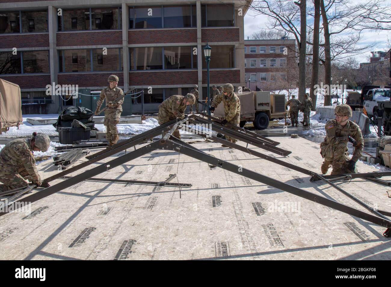 Soldiers from Charlie Company (Medical), 186 Brigade Support Battalion, 86th Infantry Brigade Combat Team (Mountain), Vermont Army National Guard, set up tents for a triage center outside the University of Vermont Medical Center Emergency Room, March 24. The medics will assist hospital personnel to sort patients based on their need if there is an influx of patients. (Photo by U.S. Army Sgt. 1st Class Jason Alvarez, Vermont National Guard) Stock Photo