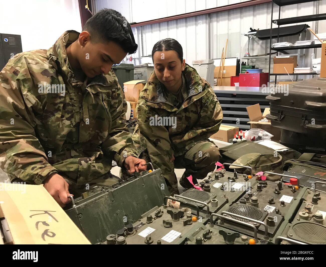 U.S. Army Pfc. Noel Zarazua and Pvt. Citlalit Flores of the California Army National Guard's 115th Regional Support Group check radio equipment at the Roseville Armory March 18, 2020, in Roseville, California. California National Guard units across the state have been activated by Gov. Gavin Newsom to support local and state agencies impacted by the COVID-19 outbreak and subsequent contaiment efforts. Cal Guard units will primarily provide support to medical, logistics and other humanitarian efforts. (Army National Guard photo by Staff Sgt. Eddie Siguenza) Stock Photo