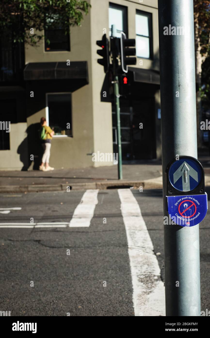 Covid-19 actions, walk light call buttons covered over to prevent the spreading of Corona virus in the Sydney CBD pedestrian crossings Stock Photo