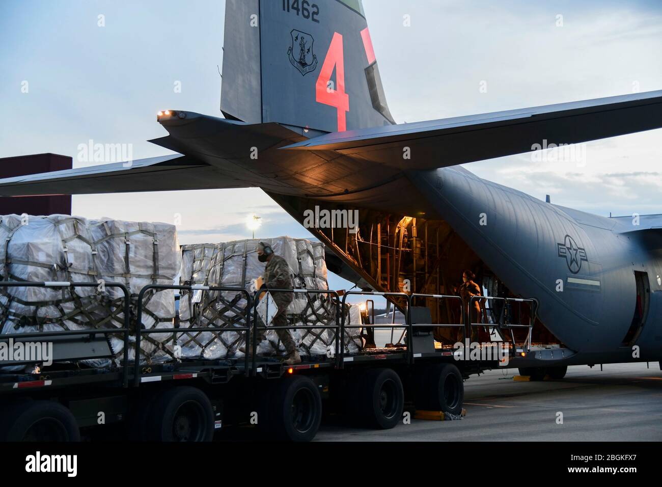 Airmen from the 146th Airlift Wing, California Air National Guard in Oxnard, CA, deliver 200 ventilators to members of the 105th AW, April 7, 2020, at Stewart Air National Guard Base, Newburgh, NY. The use of the C-130J Super Hercules, along with the NY Army National Guard, facilitated the shipment of medical equipment, which will support the ongoing COVID-19 medical treatments being conducted in the New York and New Jersey areas (U.S. Air Force Photo by SrA Jonathan Lane/Released). Stock Photo