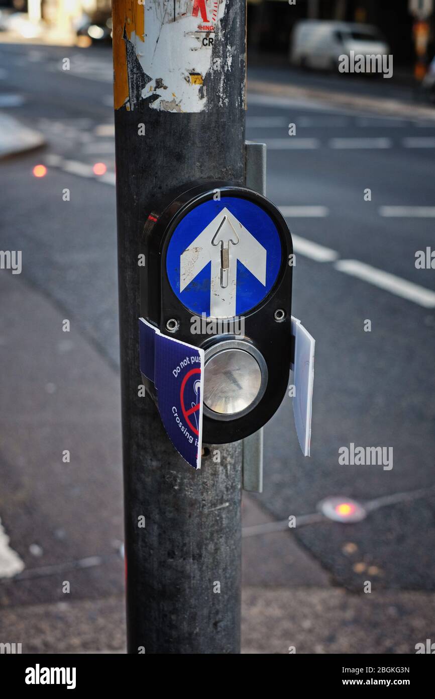 pedestrian crossing Covid-19 actions, walk light call buttons covered over to prevent the spreading of Corona virus in the Sydney CBD Stock Photo