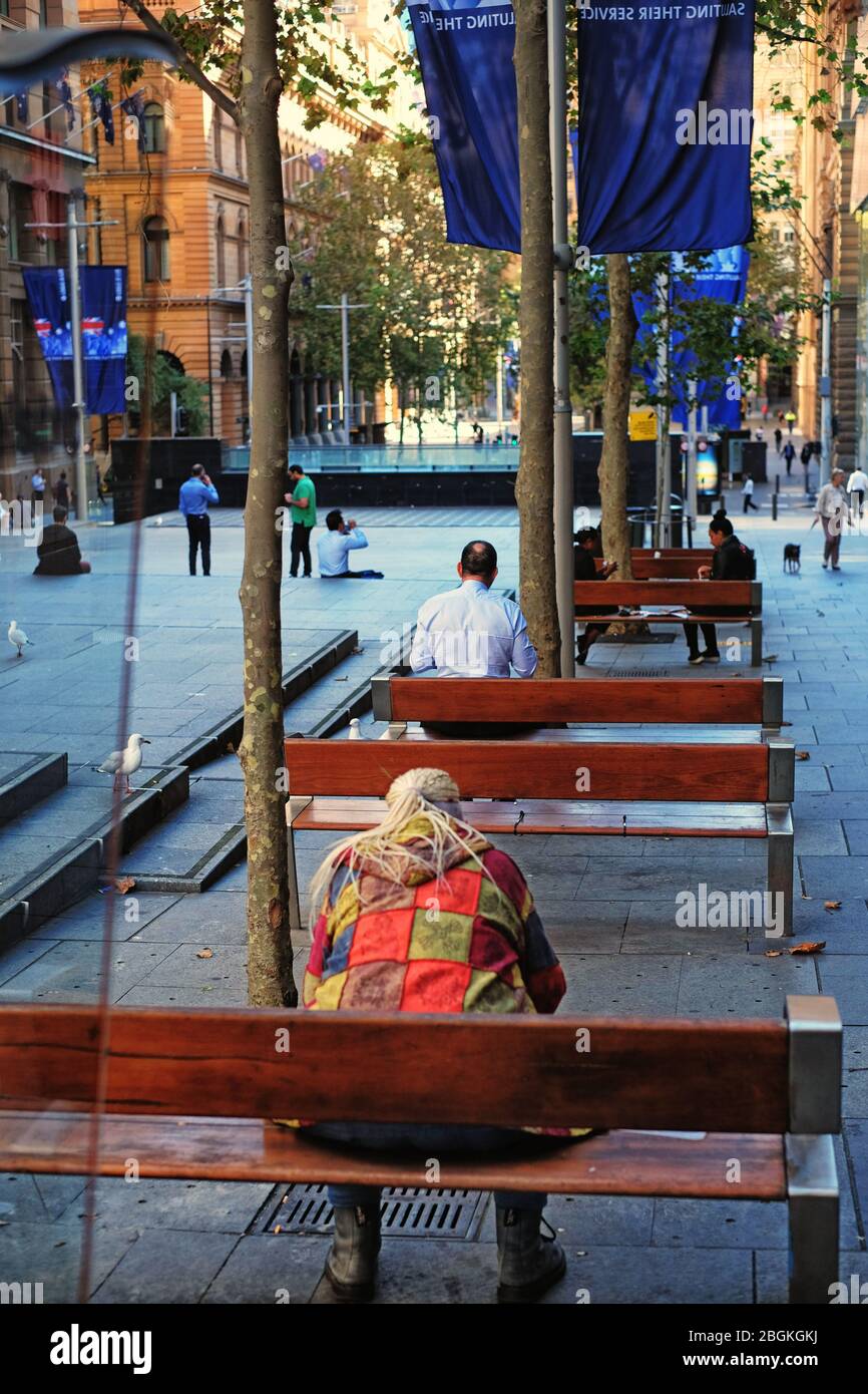 Social distancing during Covid-19 in Martin Place Sydney, people eating lunch and keeping apart to avoid corona virus Stock Photo