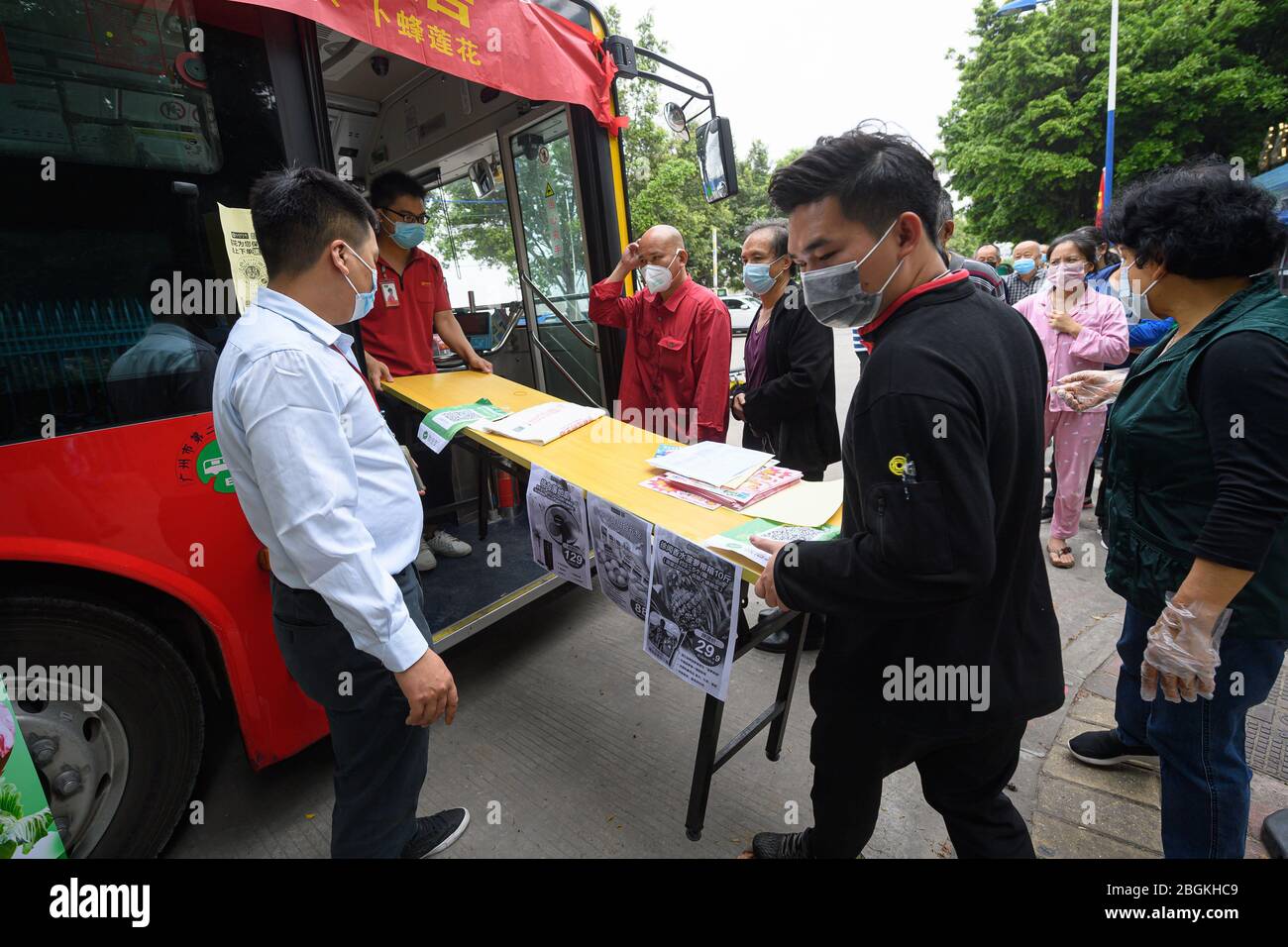 Staff prepare for the opening of the bus supermarket which is a cooperation of local bus service and supermarket for citizens' convenience, Guangzhou Stock Photo