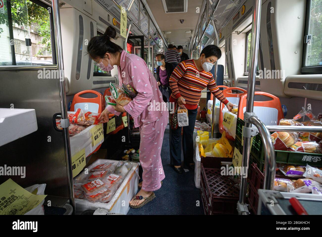 Residents purchase at the bus supermarket, which is a cooperation of local bus service and supermarket for citizens' convenience, Guangzhou city, sout Stock Photo