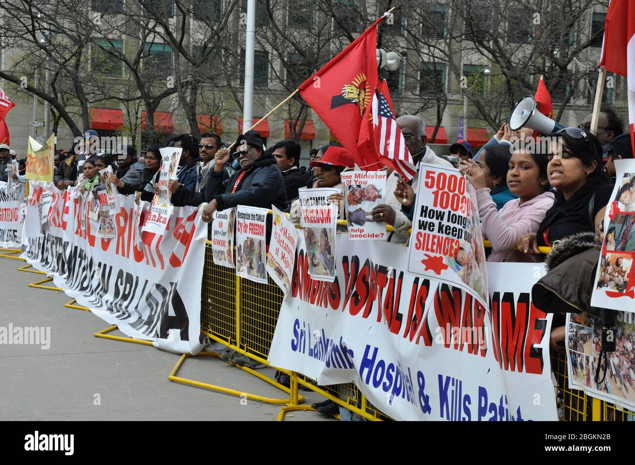 Toronto, Ontario, Canada - 05/01/2009: Protesters holding banners and placard against the Sri Lanka government on the issues on Tamils Stock Photo