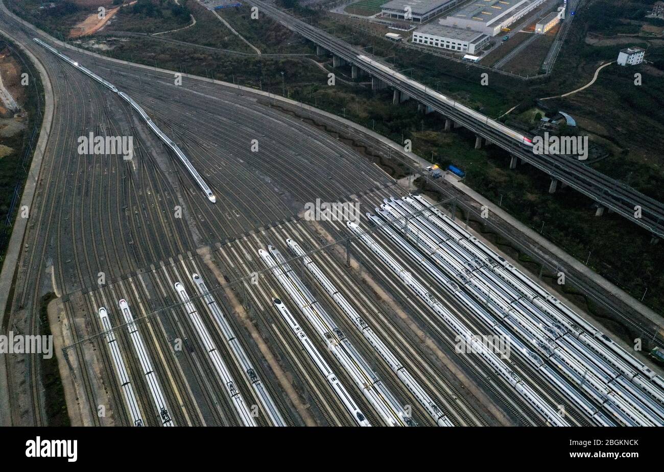 An aerial view of high-speed trains gathering at night after ...