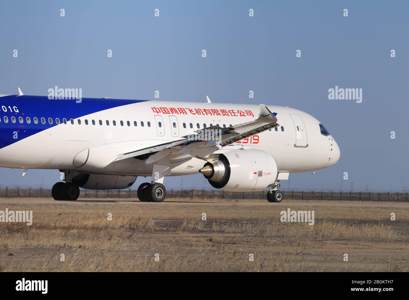 A Comac C919, a narrow-body twinjet airliner developed by Chinese aerospace manufacturer Comac, takes its test flight in Dongying city, east China's S Stock Photo