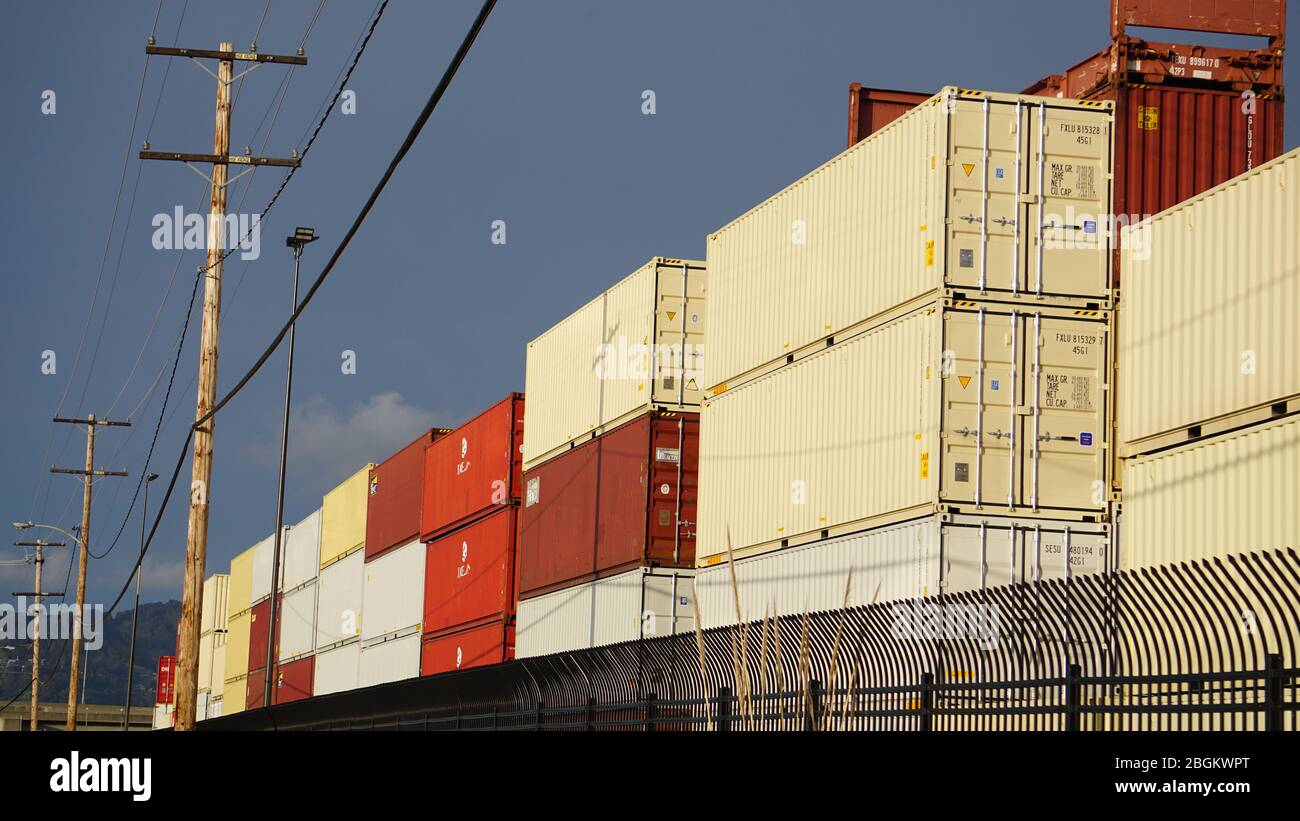 International shipping container terminal. Stacks of intermodal containers used for global trade and cargo commerce. Outer Harbor, Port of Oakland. Stock Photo