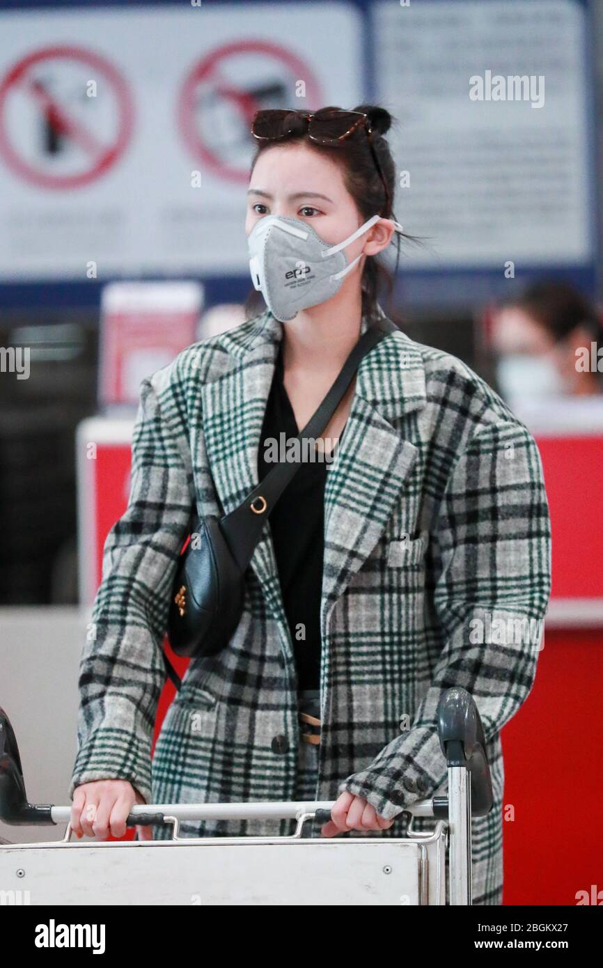 Chinese actress Zhang Yuxi arrives at a Beijing airport before ...