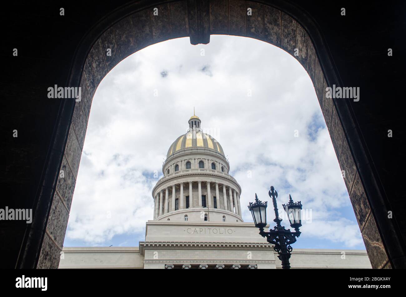 Capitol building framed through the arc of a surrounding building Stock Photo