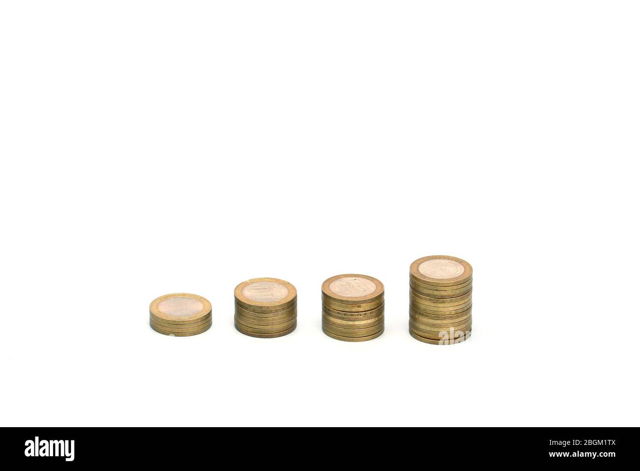 stack of metal coins neatly composed lie on a white wooden table Stock  Photo - Alamy