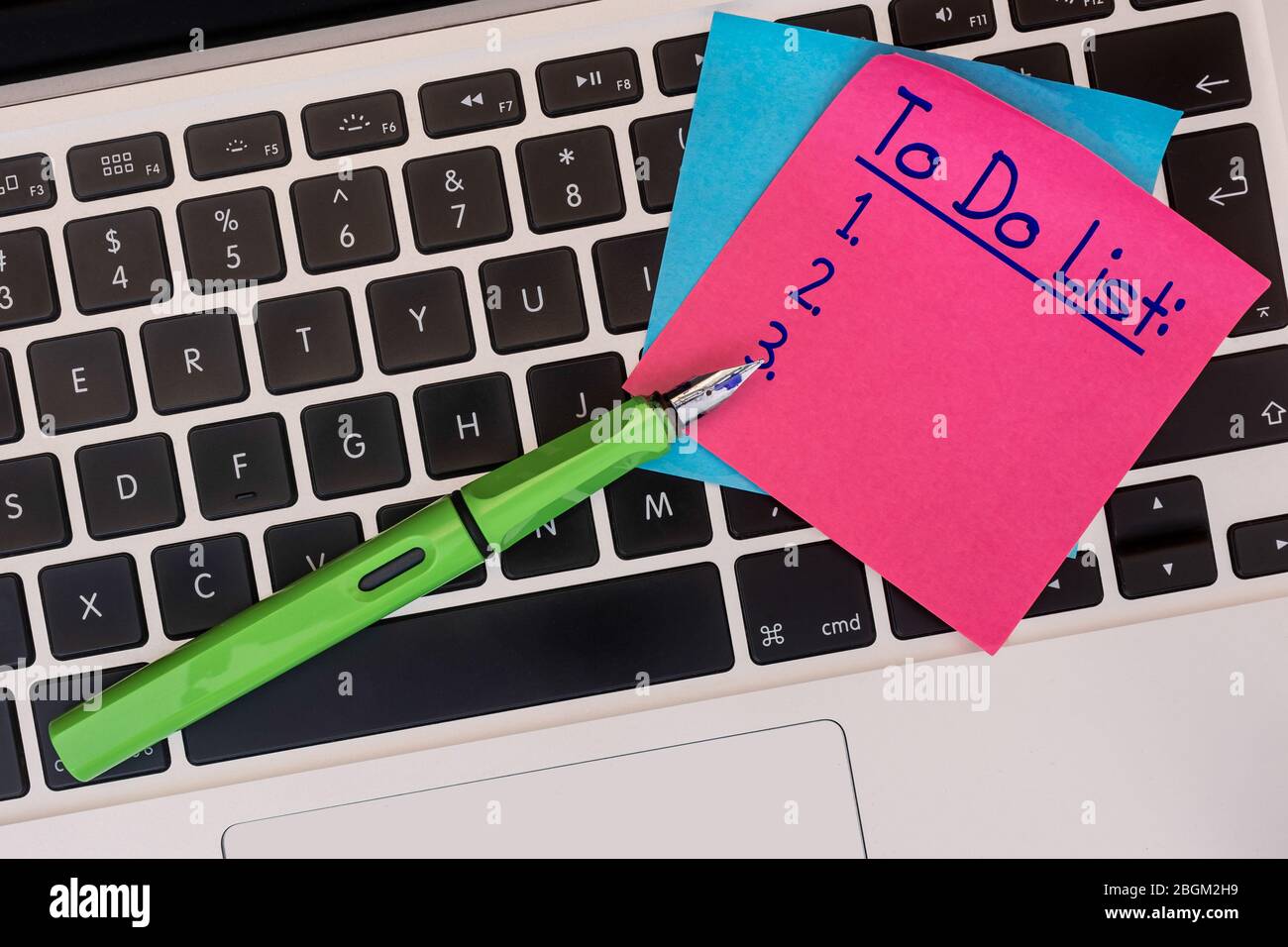 To do list on post-it on computer keyboard. Copy space. Stock Photo