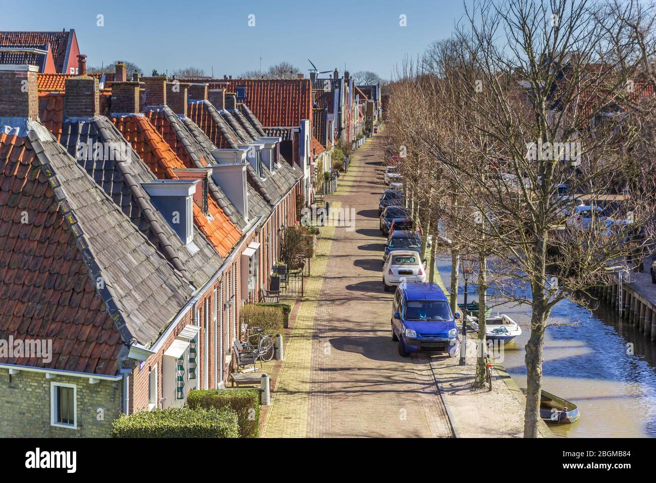 Street with historic houses at the canal of Harlingen, Netherlands