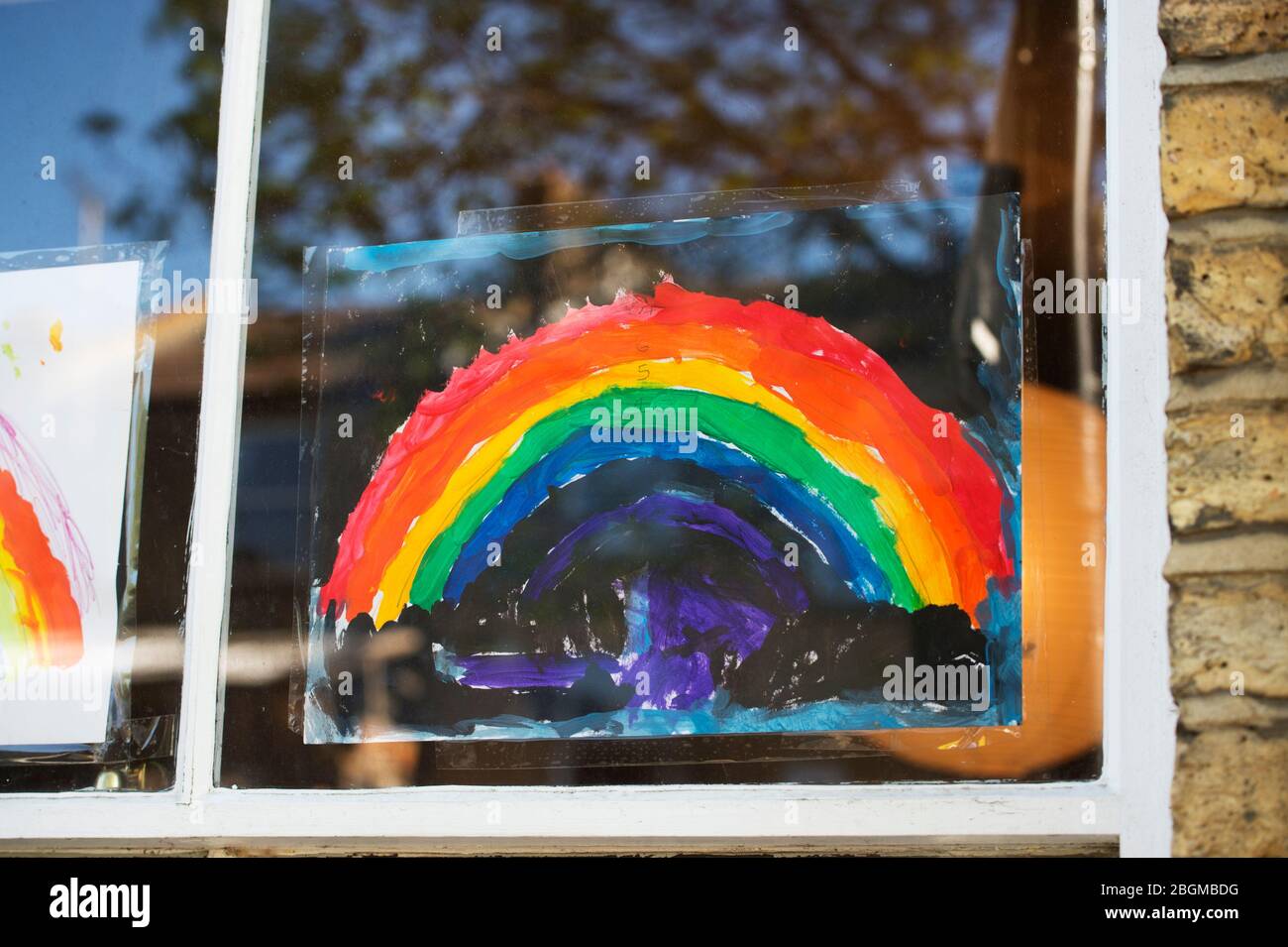 London April 2020 The Covid-19 pandemic. Rainbow drawing in a window. Stock Photo