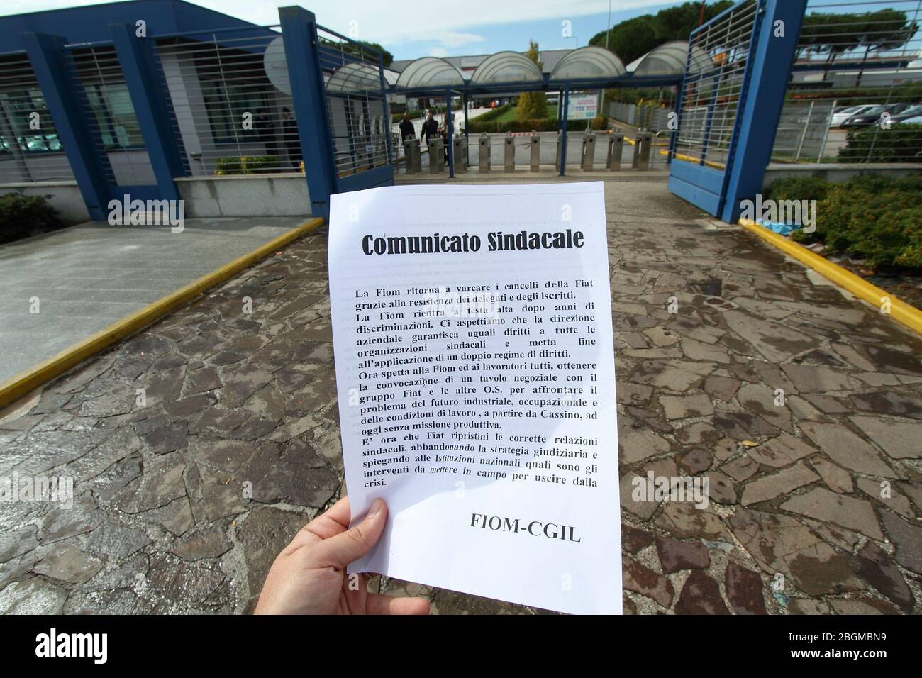 Cassino, Italy - October 9, 2013: A Fiom-Cgil flyer in front of the gates of the Fiat FCA factory in Cassino Stock Photo