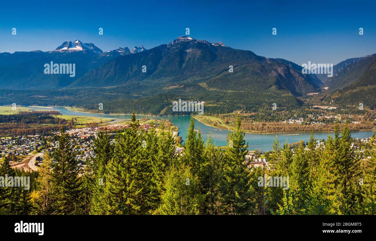 Monashee Mountains over city of Revelstoke in Columbia River Valley seen from Monashee Viewpoint, Mt Revelstoke Natl Park, British Columbia, Canada Stock Photo