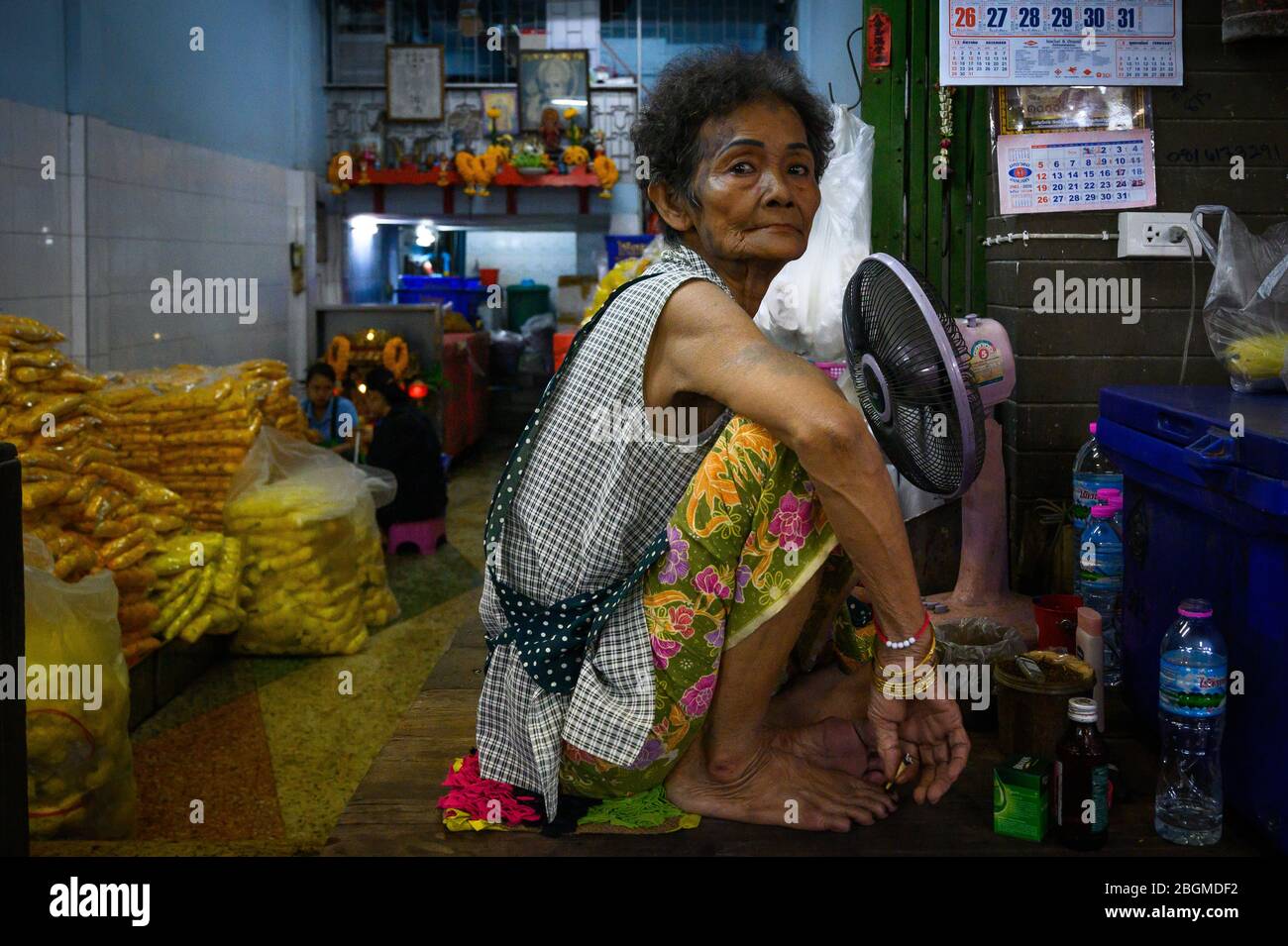 Portrait of a woman, Pak Khlong Flower Market,  Bangkok, Thailand Stock Photo